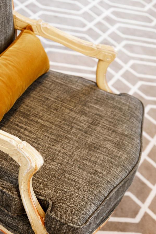 Althoff Hotel Fuerstenhof Целле Екстер'єр фото A chair upholstered in tweed